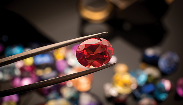An assortment of colorful polished tourmaline gemstones.